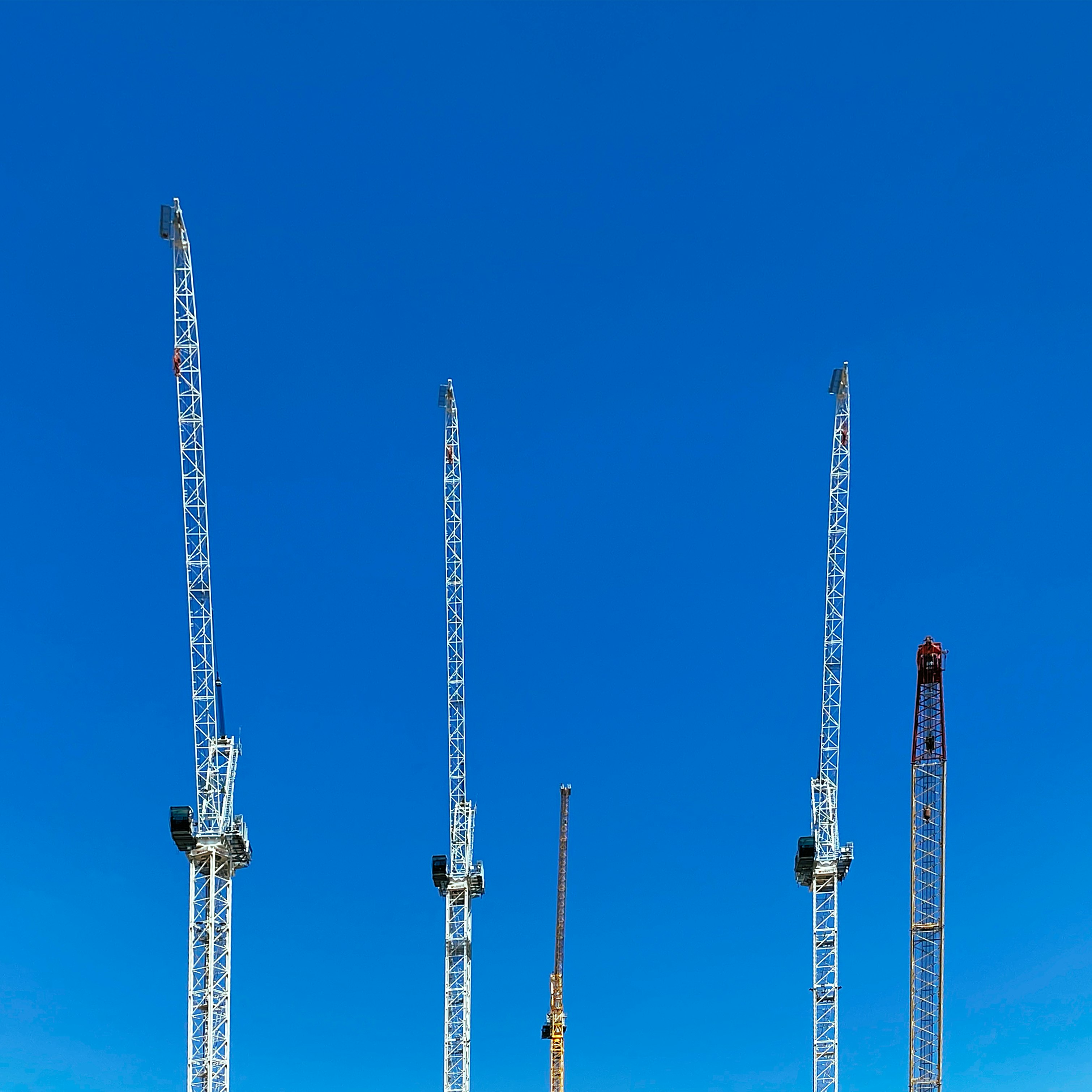white metal towers under blue sky during daytime